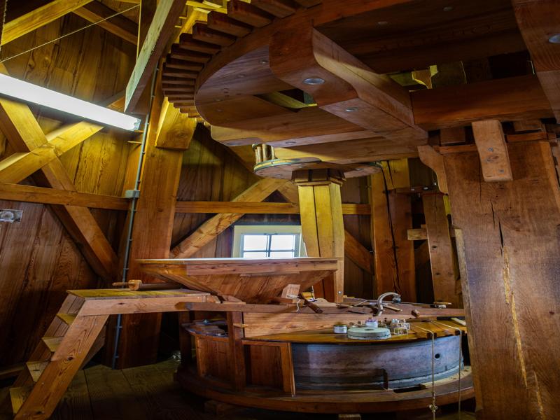 Inside the top part of the windmill that does the grinding