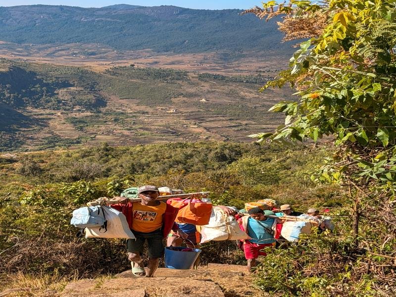 The porters coming up the trail
