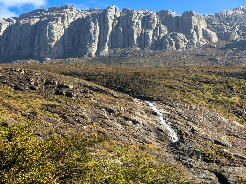 Waterfall with the granite peaks