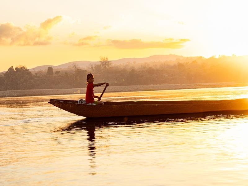 Kids canoeing down the river