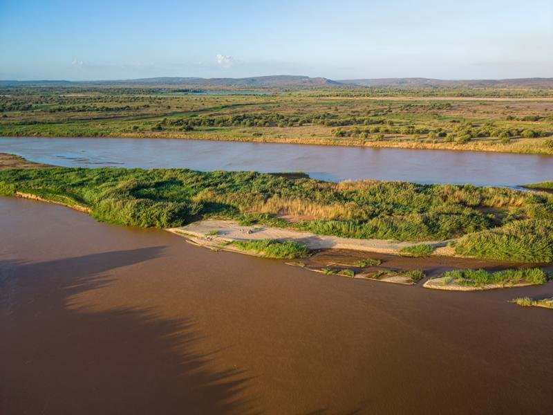 Drone view of our sand bank where we camped across from the village