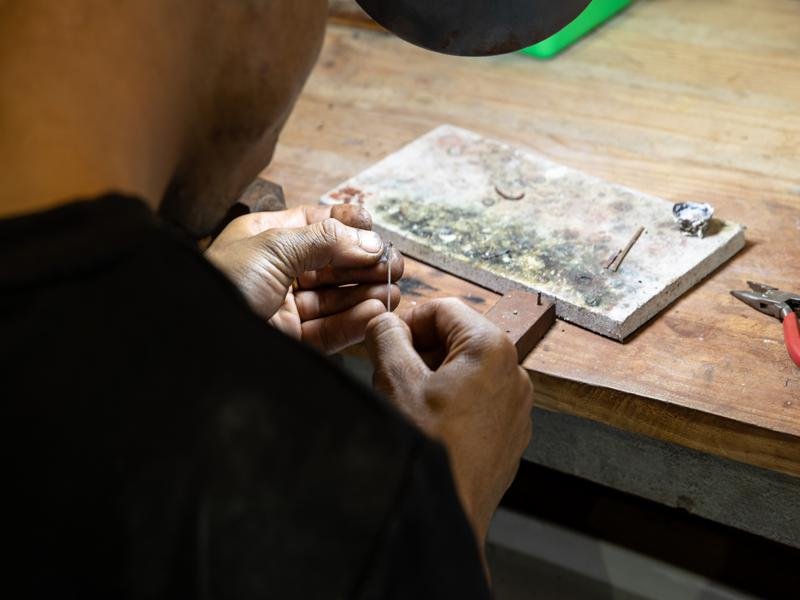 Jeweler working on gemstone fitting
