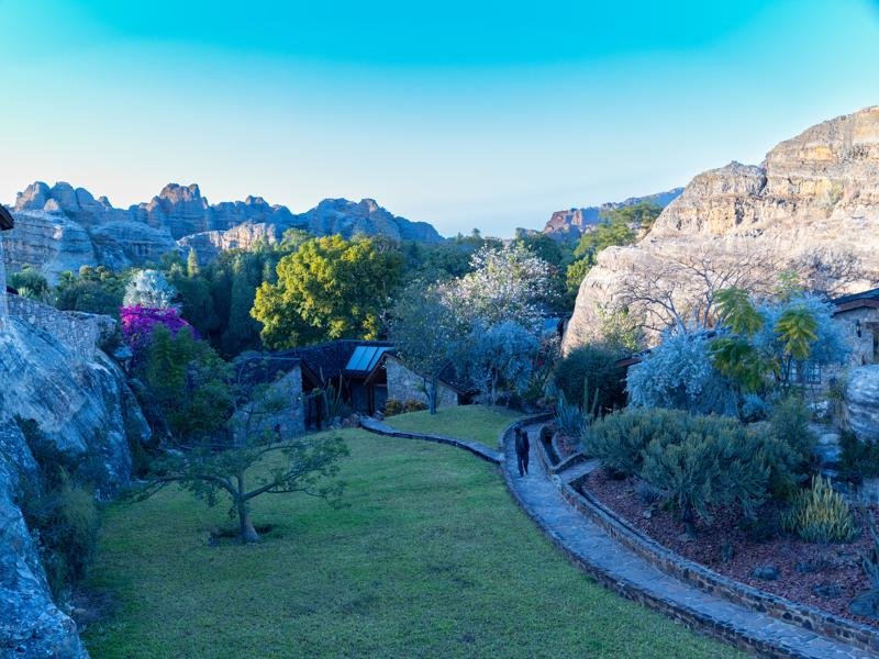 The hotel property with rock formations behind