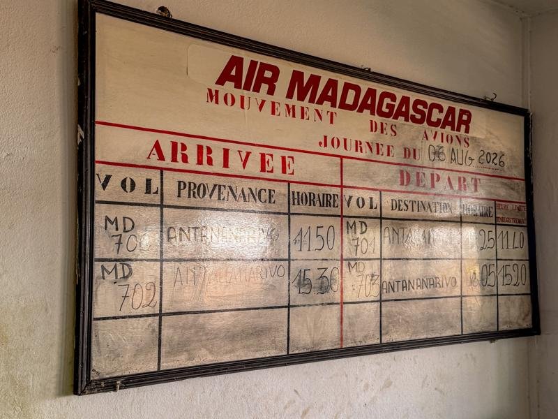 The airport is so small they have a dry erase board for flights!