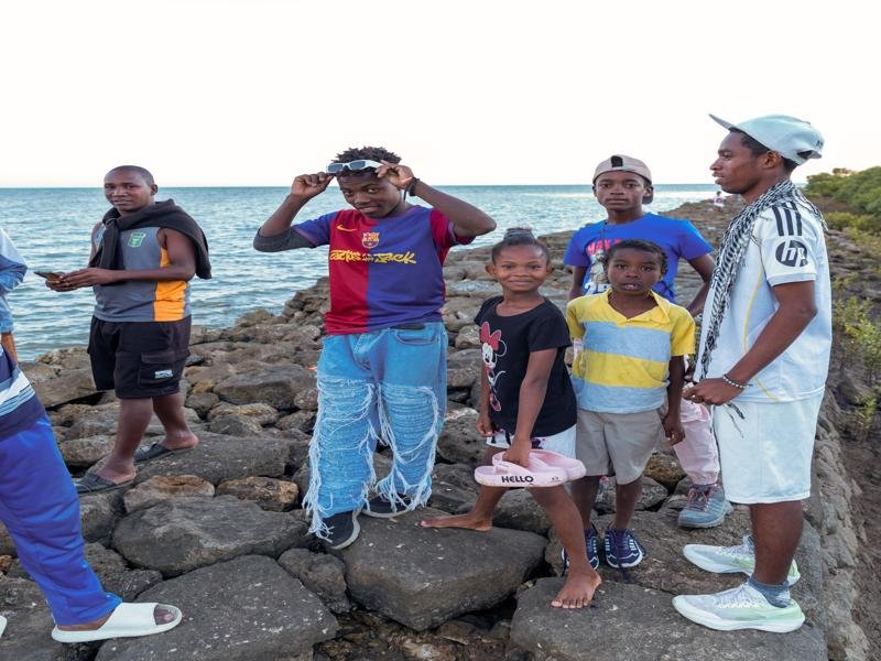 We walked out on a rocky pier, these kids wanted their picture