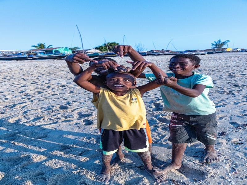 Locals hoping for candy on the beach
